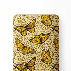 Orange Monarch Butterflies on Light Brown Print Fabric